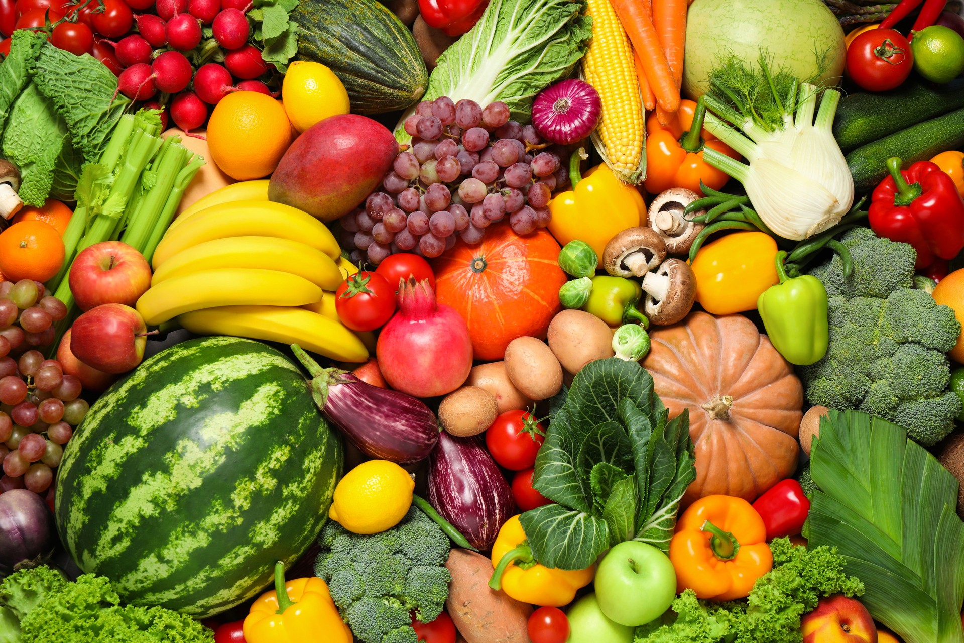 Assortment of organic fresh fruits and vegetables as background, closeup